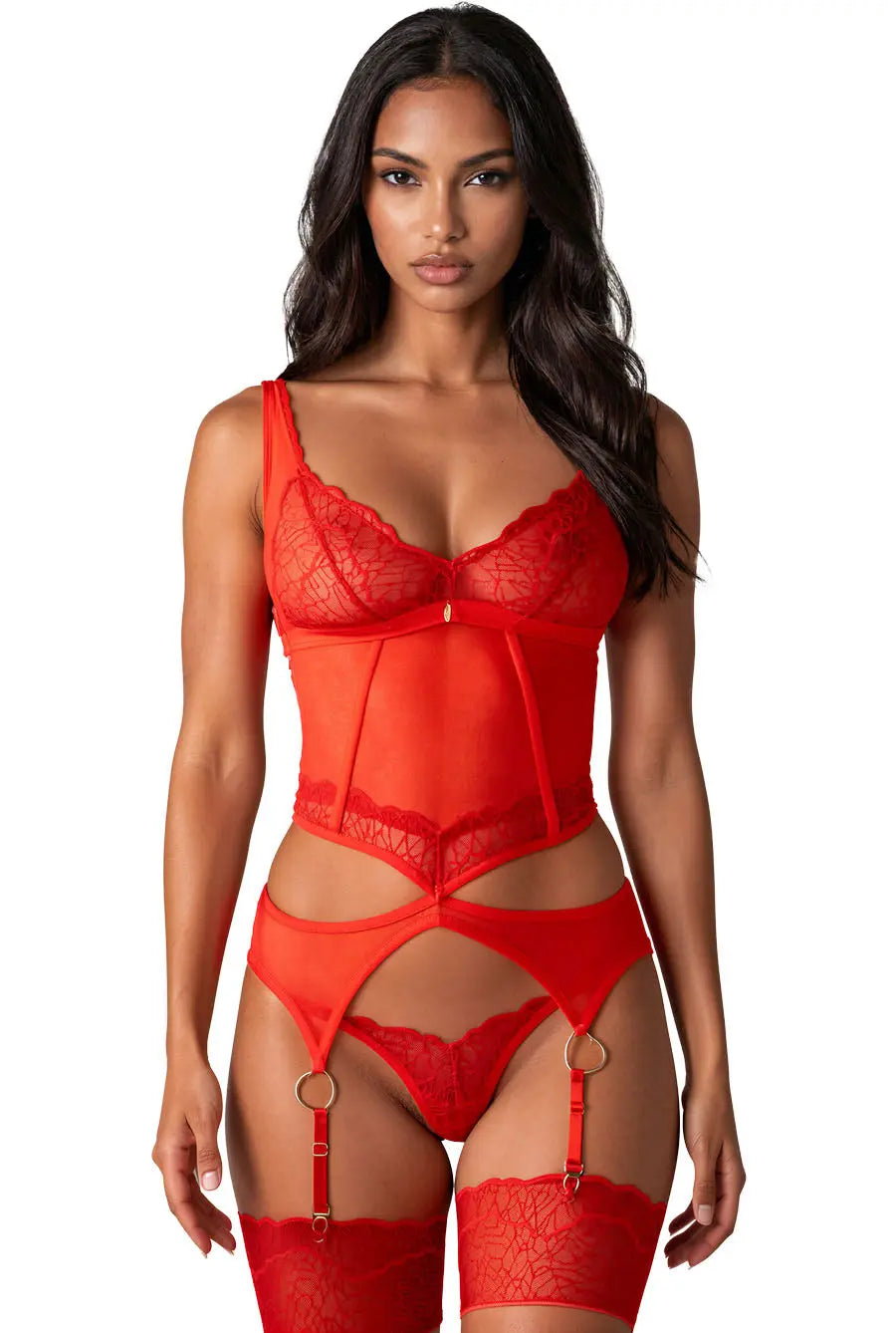 A woman modeling a bright red lace and mesh lingerie set with a structured bodysuit, matching thong, garter straps with gold-tone rings, and thigh-high lace stockings against a plain white background.